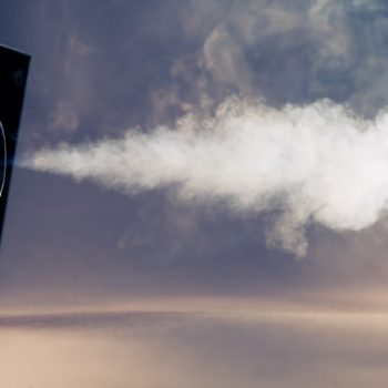 A smoke machine releases smoke into the room